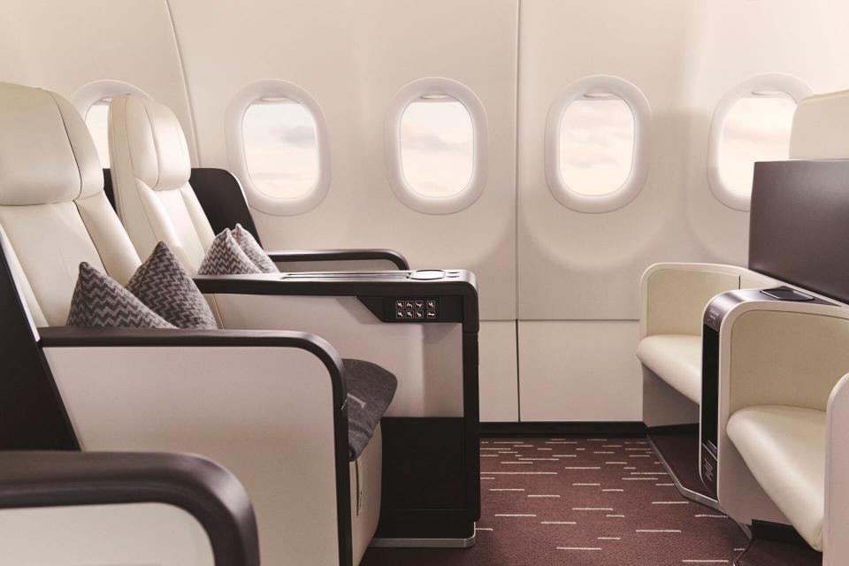 Two luxury white leather seats on board Four Seasons' Airbus A321LR