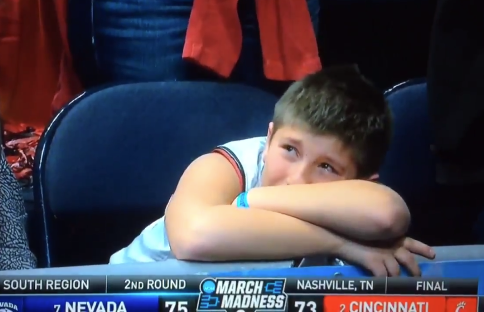 TNT cameras hung on a young Cincinnati fan for a full 12 seconds after Nevada’s epic comeback. (Screenshot: TNT/Twitter)
