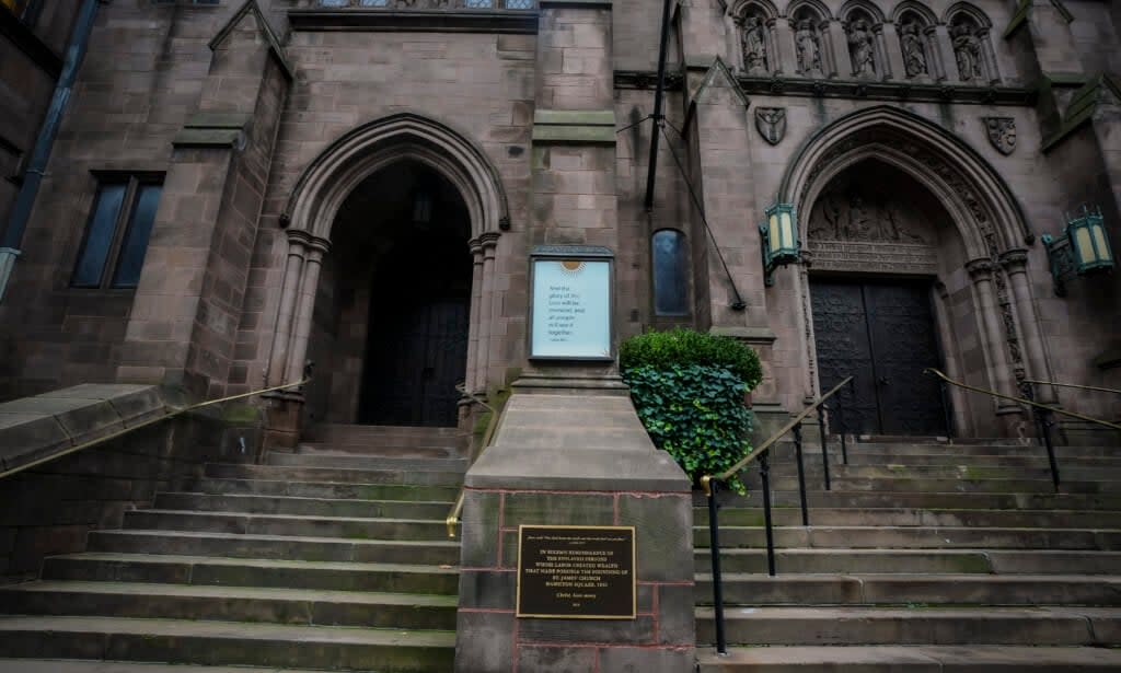 A plaque sits at the steps of St. James Episcopal Church, Friday Dec. 4, 2020, in New York’s Upper East Side neighborhood, acknowledging the church’s wealth created with slave labor. (AP Photo/Bebeto Matthews)