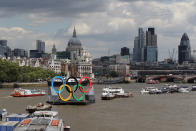 A barge displaying a giant set of Olympic rings is positioned in the centre of the River Thames on July 30, 2012 in London, England. London's transport infrastructure is expected to face a major burden today on the first working day of the London 2012 Olympic Games. (Photo by Oli Scarff/Getty Images)