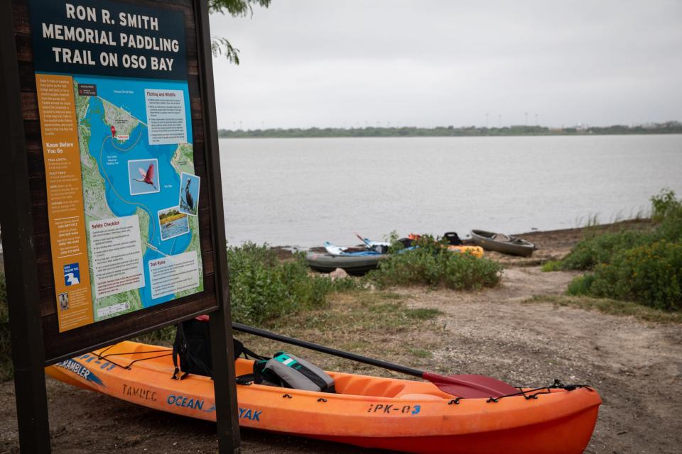 Kayaks rest at the launch area for the Ron R. Smith Memorial Paddling Trail in Oso Bay on Wednesday in Corpus Christi.