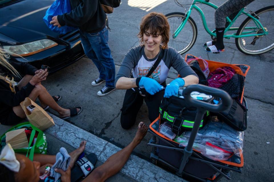 A woman administers first aid