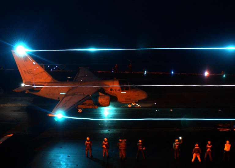 In this photo released by US Navy on March 20, 2003, a S-3 Viking assigned to the "Red Griffins" of Sea Control Squadron Three Eight (VS-38) is launched from the flight deck aboard the aircraft carrier USS Constellation during night flight operations on March 20, 2003