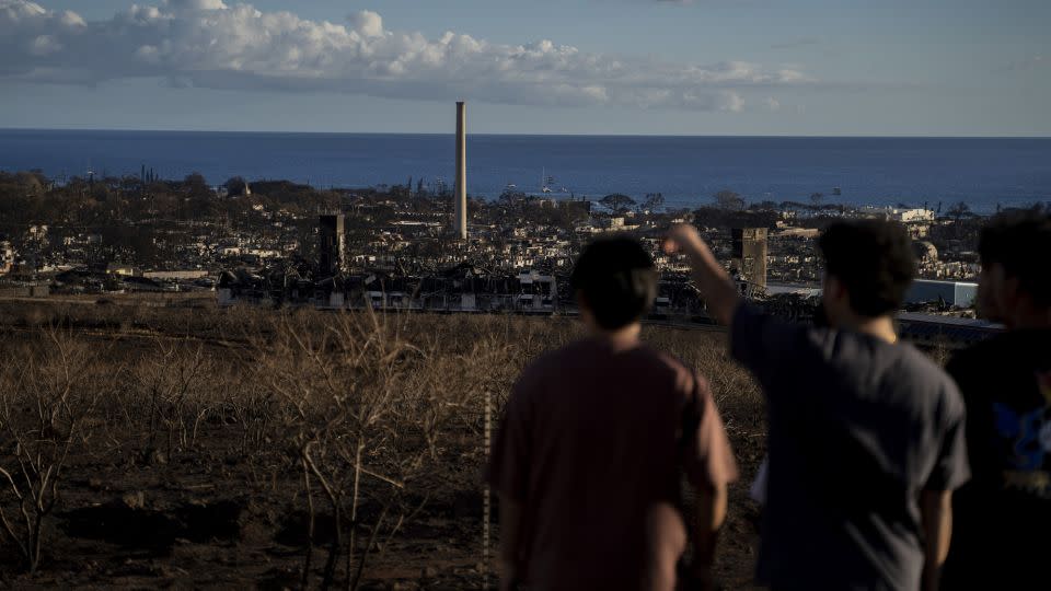 People looking down to downtown Lahaina from Lahaina Bypass in Lahaina, Hawaii on August 13, 2023. - Mengshin Lin/The Washington Post/Getty Images