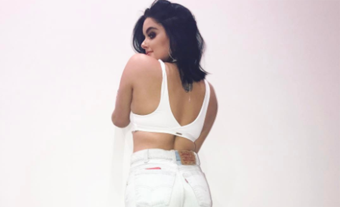 Ariel Winter posing in ripped jeans