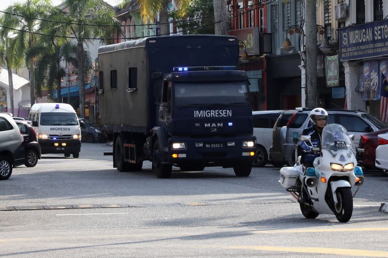 An immigration truck carrying Myanmar migrants to be deported from Malaysia is seen in Lumut