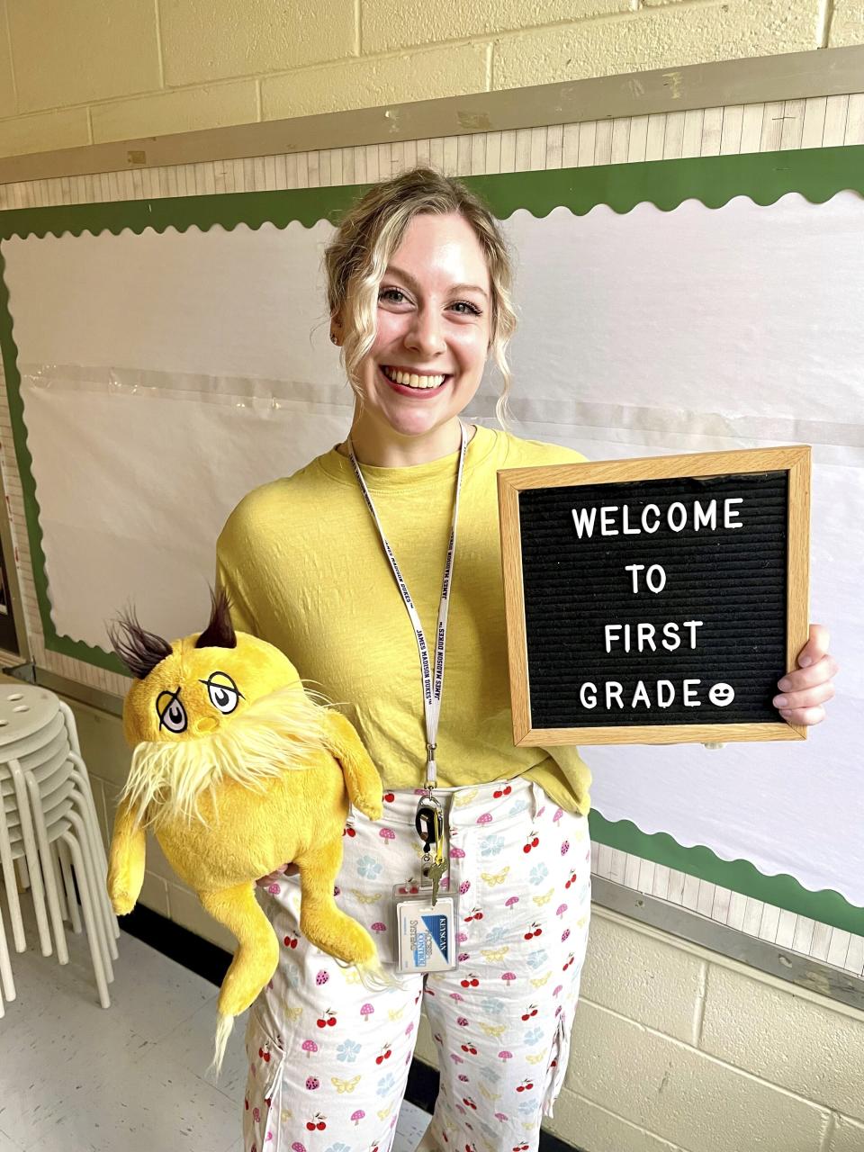 In this undated photo provided by her family and lawyers, Abigail Zwerner, a first-grade teacher at Richneck Elementary School in Newport News, Virginia, is shown inside her classroom. An attorney says Zwerner, who was shot by a 6-year-old student during class plans to sue the school district. Diane Toscano, a lawyer for Zwerner, said Wednesday, Jan. 25, 2023, that on the day of the shooting, concerned teachers and employees warned administrators three times that the boy had a gun on him and was threatening other students, “but the administration could not be bothered.” (Family of Abigail Zwerner via AP)