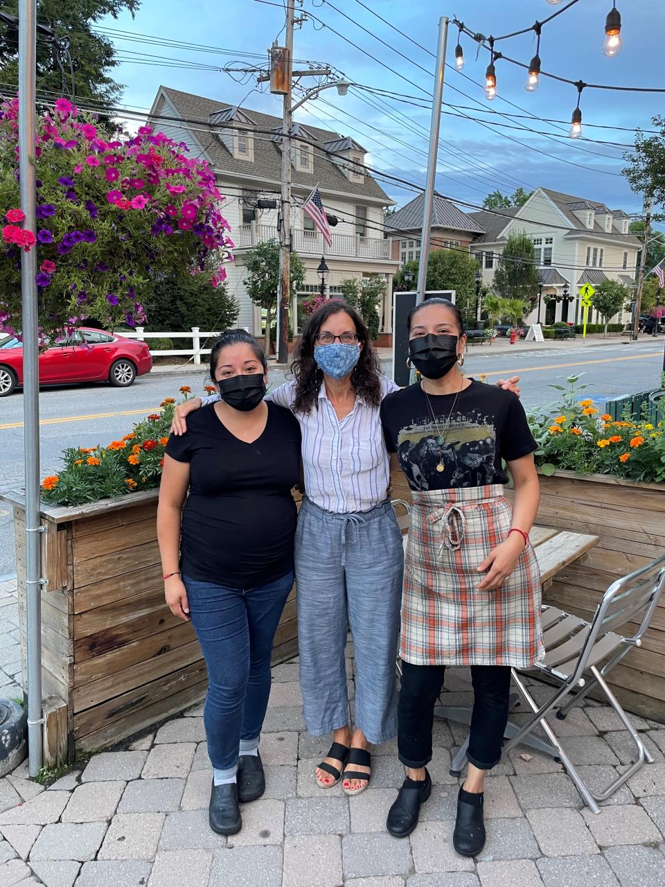 Lohud Food & Dining Reporter Jeanne Muchnick with, on left, Sheena Garcia and Joana Herrera,  on right at the terrace of their Armonk restaurant Mariachi Mexico. The photo was taken during height of the pandemic in summer 2020.