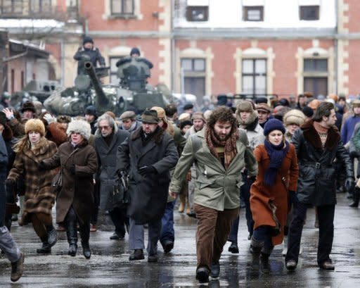 Actors during the filming of a scene in "Walesa" in Gdansk on January 14. The actors playing the militia wear actual uniforms from the period. Their vehicles include a Warszawa, a car that was the jewel in the crown of Poland's communist auto industry