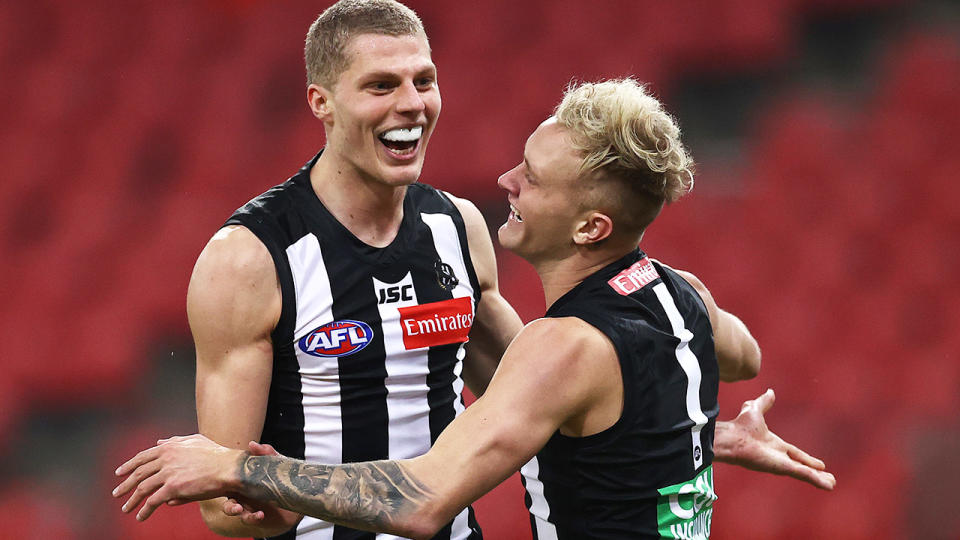 Will Kelly, pictured here celebrating his first AFL goal as Collingwood thrash Hawthorn.