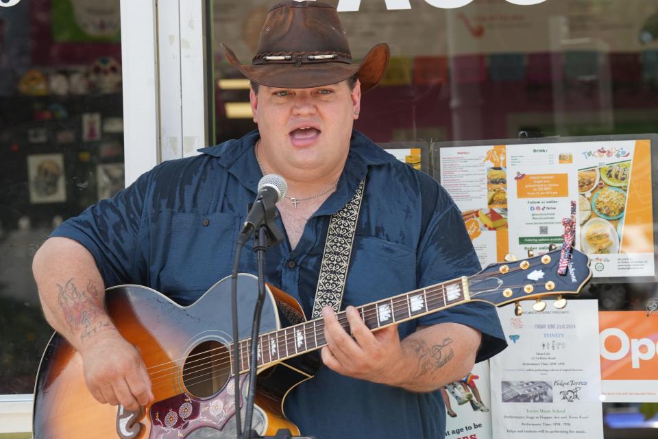 Country singer Jimmy Lee performs outside Taco Buzz on River Rd as part of Make Music Day in Fair Lawn. The day is a celebration of music that featured performers throughout town from 10am -10pm.