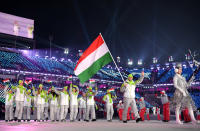 <p>Flag bearer Konrad Nagy of Hungary and teammates arrive during the Opening Ceremony of the PyeongChang 2018 Winter Olympic Games at PyeongChang Olympic Stadium on February 9, 2018 in Pyeongchang-gun, South Korea. (Photo by Matthias Hangst/Getty Images) </p>