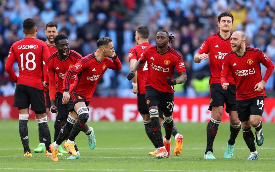 Antony of Manchester United celebrates as he cups his ear after the team's victory in the penalty shootout during the Emirates FA Cup Semi Final match between Coventry City and Manchester United at Wembley Stadium on April 21, 2024 in London, England