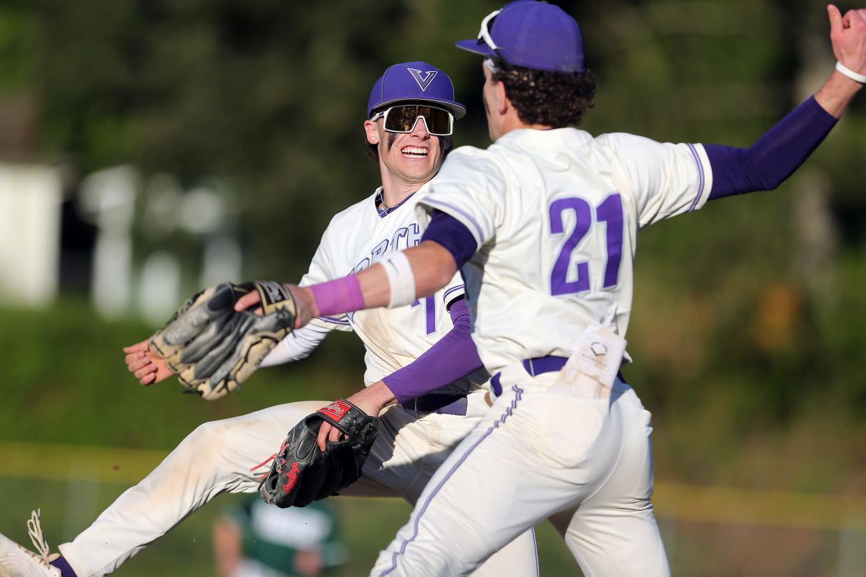 North Kitsap’a Alex Elton (7) and Nolan Rowe (21) leap into the air to celebrate their 5-2 win over Port Angeles on Tuesday, April 30, 2024.