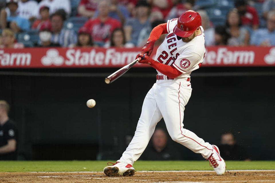 Los Angeles Angels' Jared Walsh singles during the first inning of a baseball game against the Texas Rangers Friday, Sep. 3, 2021, in Anaheim, Calif. Phil Gosselin scored. (AP Photo/Ashley Landis)