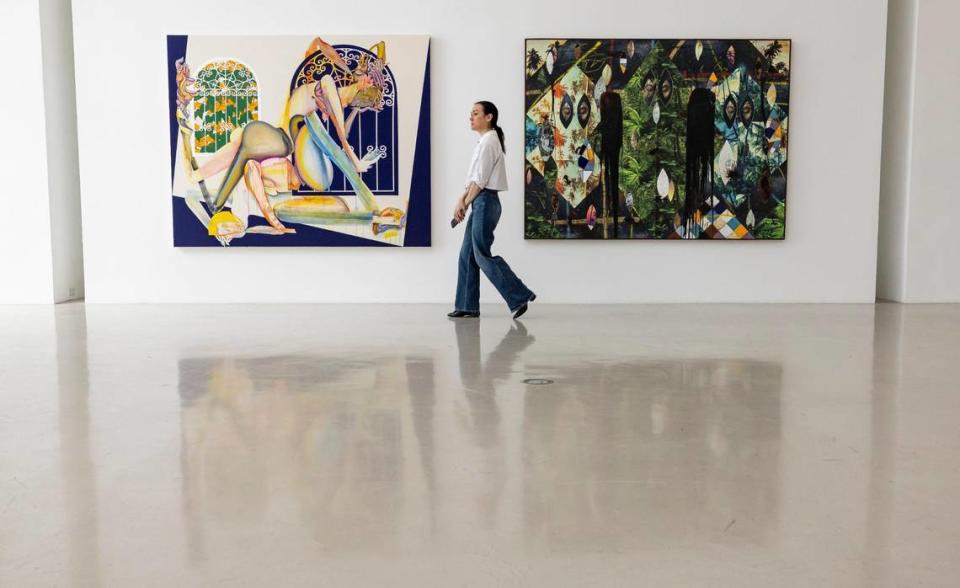 Jessica Stanley, Christie’s public relations director walks past works by Christina Quarles, left, and Rashid Johnson that were owned by Rosa de la Cruz at the de la Cruz Collection on Monday, April 8, 2024, in Miami, Florida. Christies’s will begin selling works from De la Cruz’s collection in May.