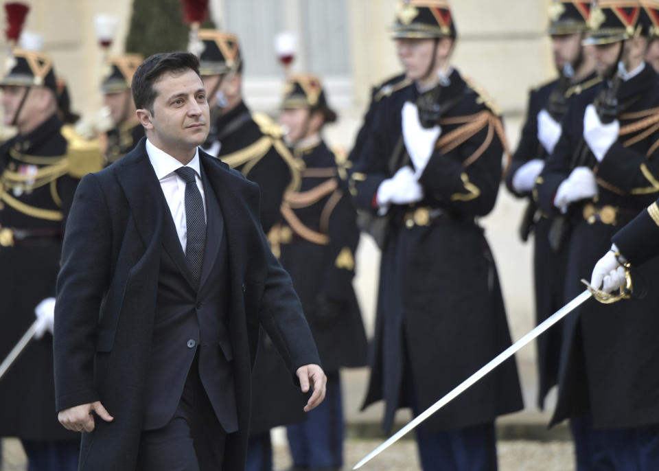 Ukrainian President Volodymyr Zelenskiy arrives to the Elysee Palace, Paris, France, Monday, Dec. 9, 2019. A long-awaited summit in Paris is aiming to find a way to end the war in Ukraine, after five years and 14,000 lives lost in a conflict that has emboldened the Kremlin and reshaped European geopolitics. (Alexei Nikolsky, Sputnik, Kremlin Pool Photo via AP)