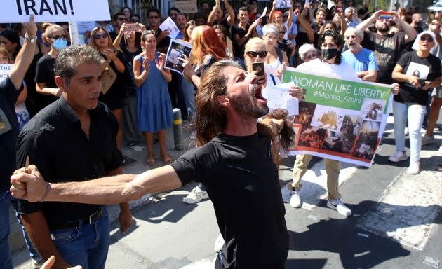 People shout slogans during a protest Sunday against the death of Iranian Mahsa Amini, outside the Iranian Embassy, in Nicosia, Cyprus. (Photo: Philippos Christou/AP)