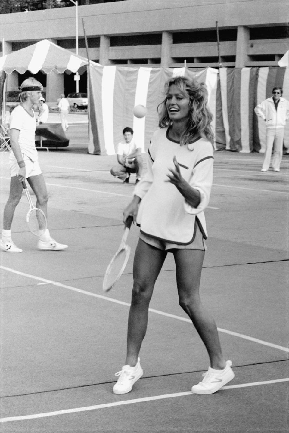 <p><em>Charlie's Angels</em> star Farrah Fawcett plays tennis, September 1, 1976.</p>