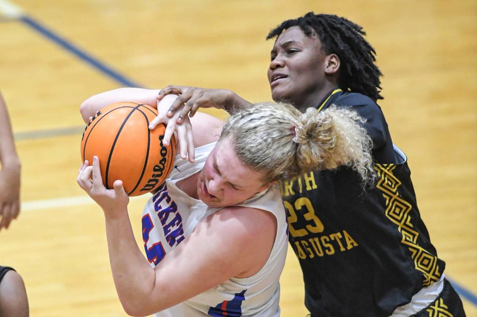 Pickens guard Sadie McKinney (44) rebounds near North Augusta forward Celena Grant (23) during the first quarter of the AAAA State Playoff game in Pickens, S.C. Tuesday, Feb. 21, 2023.