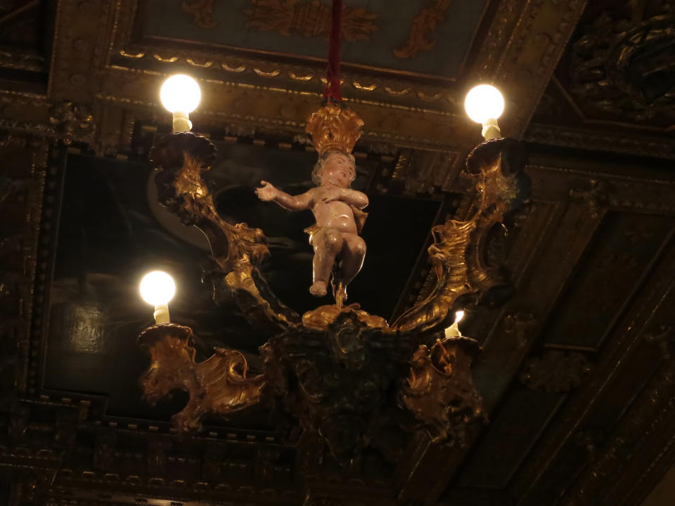 This Aug. 30, 2013 photo shows a lighting fixture hanging in The Hearst Castle, the 165-room estate of newspaper publisher William Randolph Hearst, in San Simeon, Calif. (AP Photo/Jim MacMillan)