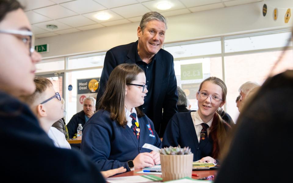 Labour leader Sir Keir Starmer with school children in Ripley