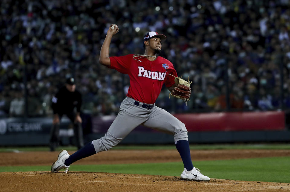 Panama pitcher Humberto Mejia pitches to a Taiwan batter during the first inning at Taichung Intercontinental Baseball Stadium in Taichung, Wednesday, March 8, 2023. (AP Photo/I-Hwa Cheng)