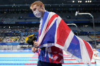 Tom Dean of Britain celebrates after winning the men's 200-meter freestyle at the 2020 Summer Olympics, Tuesday, July 27, 2021, in Tokyo, Japan. (AP Photo/Martin Meissner)