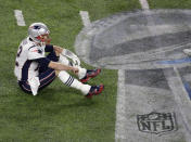 FILE - In this Feb. 4, 2018, file photo, New England Patriots quarterback Tom Brady sits on the field after fumbling against the Philadelphia Eagles during the second half of the NFL Super Bowl 52 football game, in Minneapolis. The Eagles upset the Patriots 41-33. (AP Photo/Eric Gay, File)