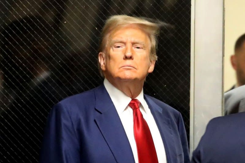 Former President Donald Trump in the hallway outside a courtroom where he attended a hearing in his criminal case on charges stemming from hush money paid to an adult film actress in New York City on March 25. Pool Photo by Spencer Platt/UPI