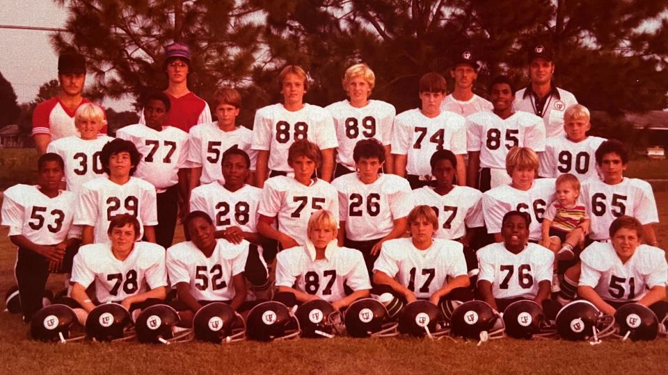 Tim Slaten's football team photo was taken a month after Linda's murder. Tim hung it on his bedroom wall as a reminder, he says, of something his mom taught him: to keep moving forward and never give up. / Credit: Tim Slaten