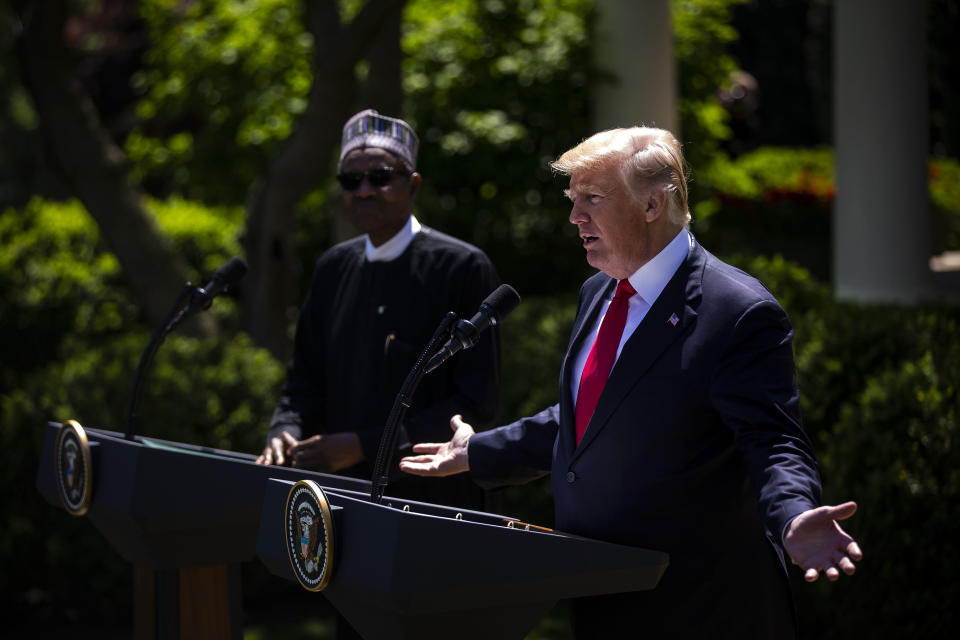 President Donald Trump speaks with Nigerian president Muhammadu Buhari. Nigeria is one of three new nations where Trump has used the 2001 authorization as justification for the deployment of U.S. troops. (Photo: Bloomberg via Getty Images)