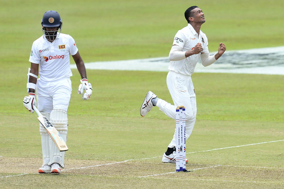 Bangladesh's Taskin Ahmed, right, celebrates the dismissal of Sri Lanka's Lahiru Thirimanne, left, during the second day of the second test cricket match between Sri Lanka and Bangladesh in Pallekele, Sri Lanka, Friday, April 30, 2021.( AP Photo/Sameera Peiris)