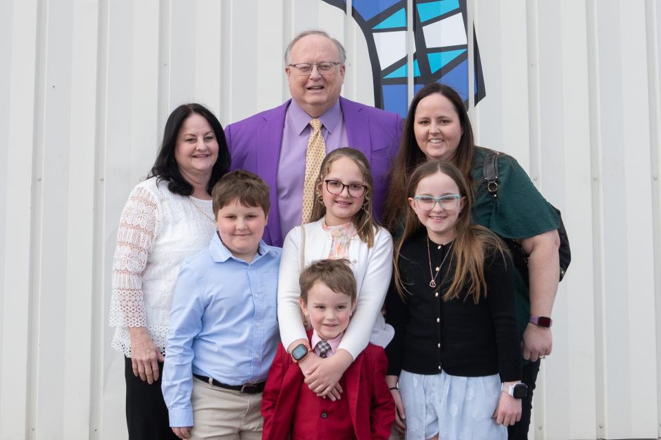 The Lynn Family poses for a portrait in front of the Norton Healthcare Transport Hangar at Bowman Field on Wednesday, March 20, 2024.