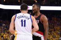Portland Trail Blazers forward Maurice Harkless (4, right) talks to Golden State Warriors guard Klay Thompson (11) during the third quarter in game two of the second round of the NBA Playoffs at Oracle Arena. The Warriors defeated the Trail Blazers 110-99. Mandatory Credit: Kyle Terada-USA TODAY Sports