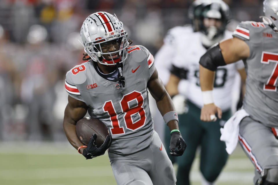 Ohio State receiver Marvin Harrison runs for a touchdown against Michigan State during the first half of an NCAA college football game Saturday, Nov. 11, 2023, in Columbus, Ohio. (AP Photo/Jay LaPrete)