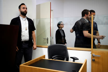 U.S. student Lara Alqasem (C) enters the courtroom before the start of a hearing in her case at the district court in Tel Aviv, Israel October 11, 2018. REUTERS/Amir Cohen