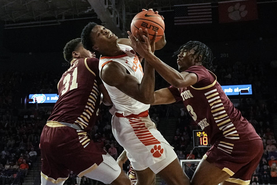 Clemson forward RJ Godfrey (10) drives against Boston College forward Elijah Strong (31) during the first half of an NCAA college basketball game, Saturday, Jan. 13, 2024, in Clemson, S.C. (AP Photo/Mike Stewart)