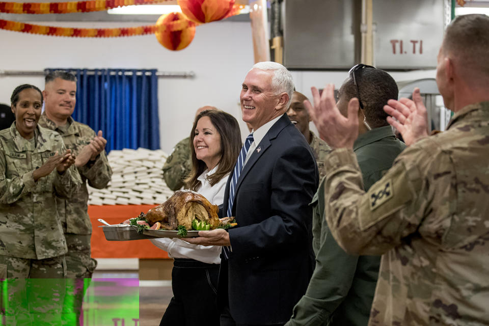 Vice President Mike Pence and his wife Karen Pence arrive with turkey to serve to troops at Al Asad Air Base, Iraq, Saturday, Nov. 23, 2019. The visit is Pence’s first to Iraq and comes nearly one year since President Donald Trump’s surprise visit to the country. (AP Photo/Andrew Harnik)