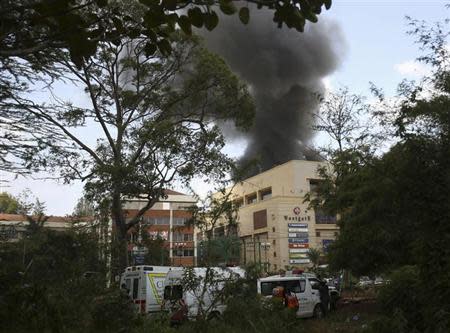 Smoke rises over Westgate shopping centre after an explosion in Nairobi, September 23, 2013. Powerful explosions sent thick smoke billowing from the Nairobi mall where militants from Somalia's al Qaeda-linked al Shabaab group threatened to kill hostages on the third day of a raid in which at least 59 have already died. REUTERS/Karel Prinsloo