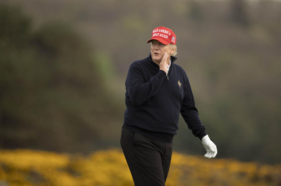 Donald Trump playing golf at his Trump Turnberry resort in South Ayrshire