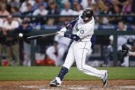 Aug 23, 2016; Seattle, WA, USA; Seattle Mariners second baseman Robinson Cano (22) hits a single against the New York Yankees during the fourth inning at Safeco Field. Mandatory Credit: Joe Nicholson-USA TODAY Sports / Reuters