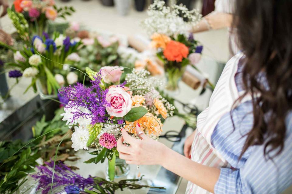 <p>Getty</p> A stock image of women arranging flowers