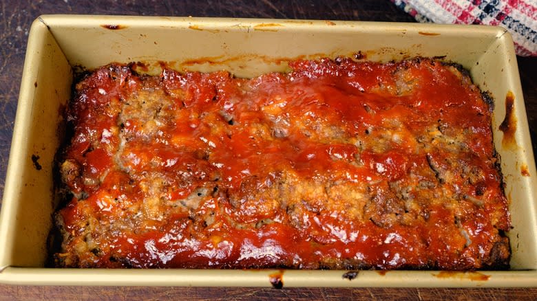 meatloaf in pan with red topping