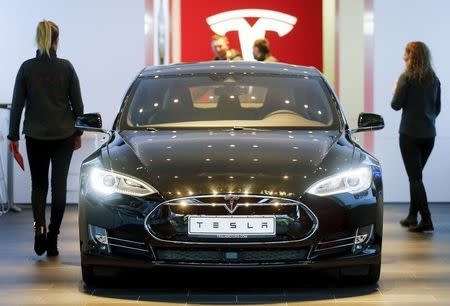 A Tesla car 'Model S' sits in a dealership in Berlin, Germany, November 18, 2015. REUTERS/Hannibal Hanschke