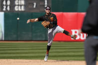 San Francisco Giants shortstop Casey Schmitt throws out Oakland Athletics' Tony Kemp in the fifth inning of a spring training baseball game in Oakland, Calif., Sunday, March 26, 2023. Kemp grounded out on the play. (AP Photo/Eric Risberg)