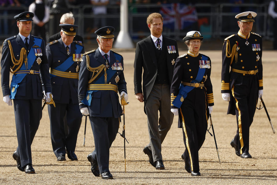 FILE - From left, Prince William, the Duke of Gloucester, King Charles III, Prince Harry, Princess Anne and Timothy Laurence follow the coffin of Queen Elizabeth II from Buckingham Palace to Westminster Hall, London on Sept. 14, 2022. Prince Harry flew more than 5,000 miles to see his father after King Charles III was diagnosed with cancer. But he did not see his estranged brother, William, during a visit that lasted scarcely 24 hours. William, meanwhile, returned to public duties for the first time since his wife, Kate, was admitted to a London hospital Jan. 16 for abdominal surgery. (Jeff J Mitchell/Pool via AP, File)