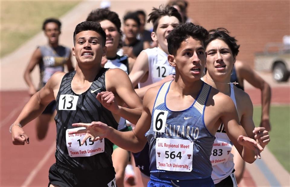 Big Spring's Adrian Solis, left, battles San Elizario's Christopher Moreno and Snyder's Jeremiah Rodriguez, right, to the finish line in the 800 meters at the Region I-4A track and field meet Saturday at Lowrey Field. Moreno won in 1:56.31, while Solis was second (1:56.61) and Rodriguez was third (1:57.02).