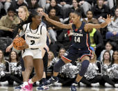 Providence's Grace Efosa (2) defends the ball from UConn's Aubrey Griffin (44) during the first half of an NCAA college basketball game, Wednesday, Feb. 1, 2023, in Providence, R.I. (AP Photo/Mark Stockwell)