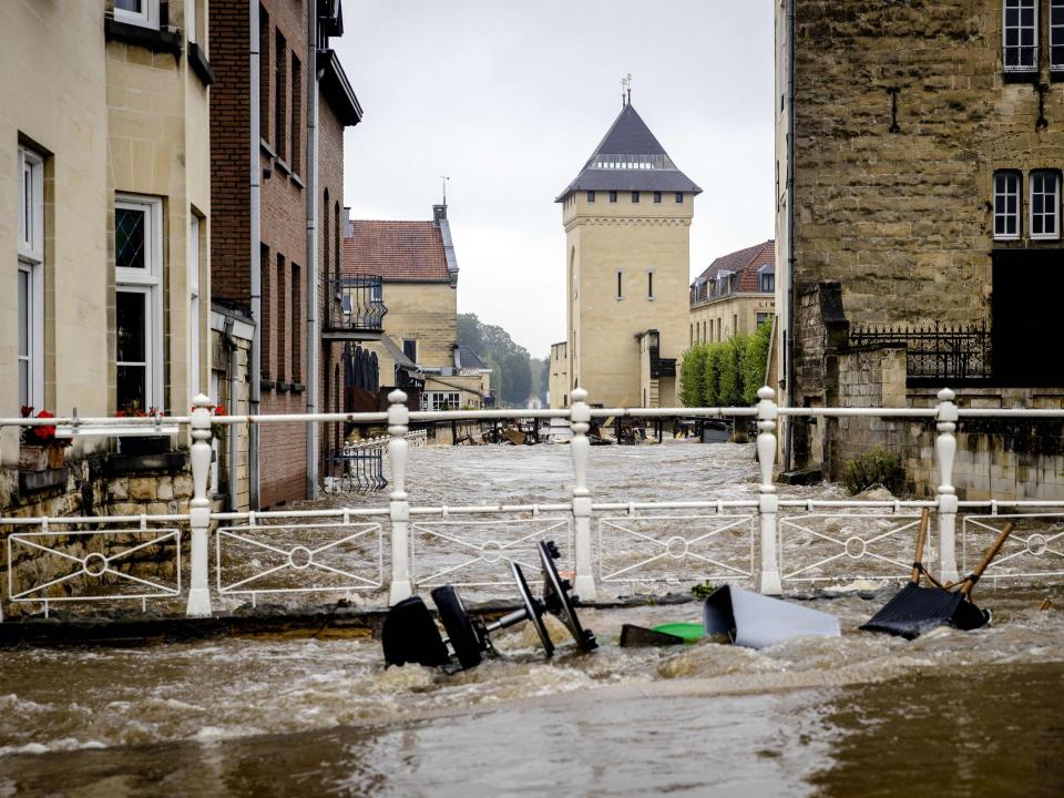 Flood waters rush through the centre of Valkenburg aan de Geul (Sem Van Der Wal/AFP/Getty)